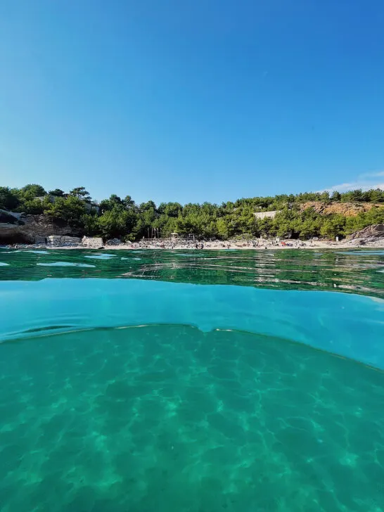 best island in greece for couples view of teal water looking toward shore with