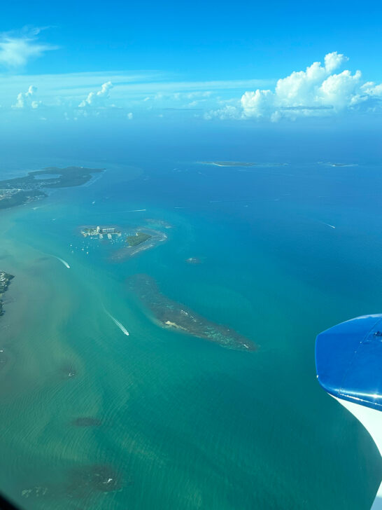 views while flying to Vieques Puerto Rico with teal water and small islands below