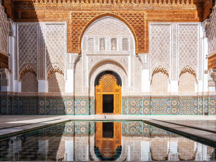 40th birthday travel ideas view of large building with detailed mosaic tile and pool reflecting it