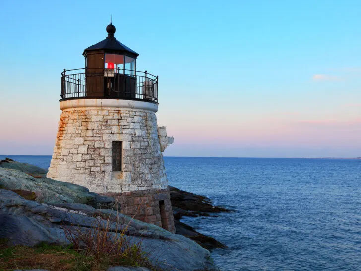 lighthouse along ocean at dusk best places to travel in October in USA