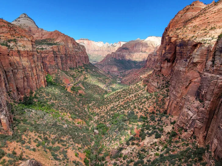 Zion national park large canyon looking down with trees and road best places to visit in October USA