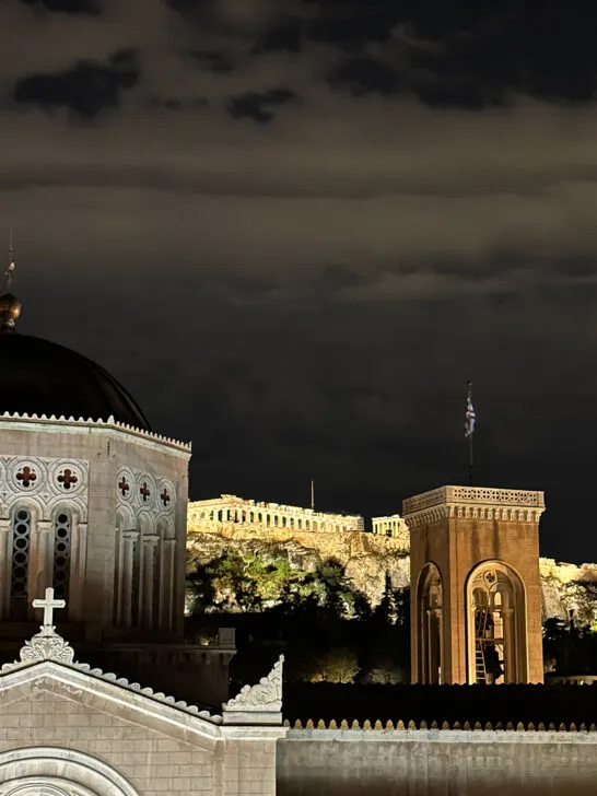 athens literary with view of church top and parthenon at night with dark sky