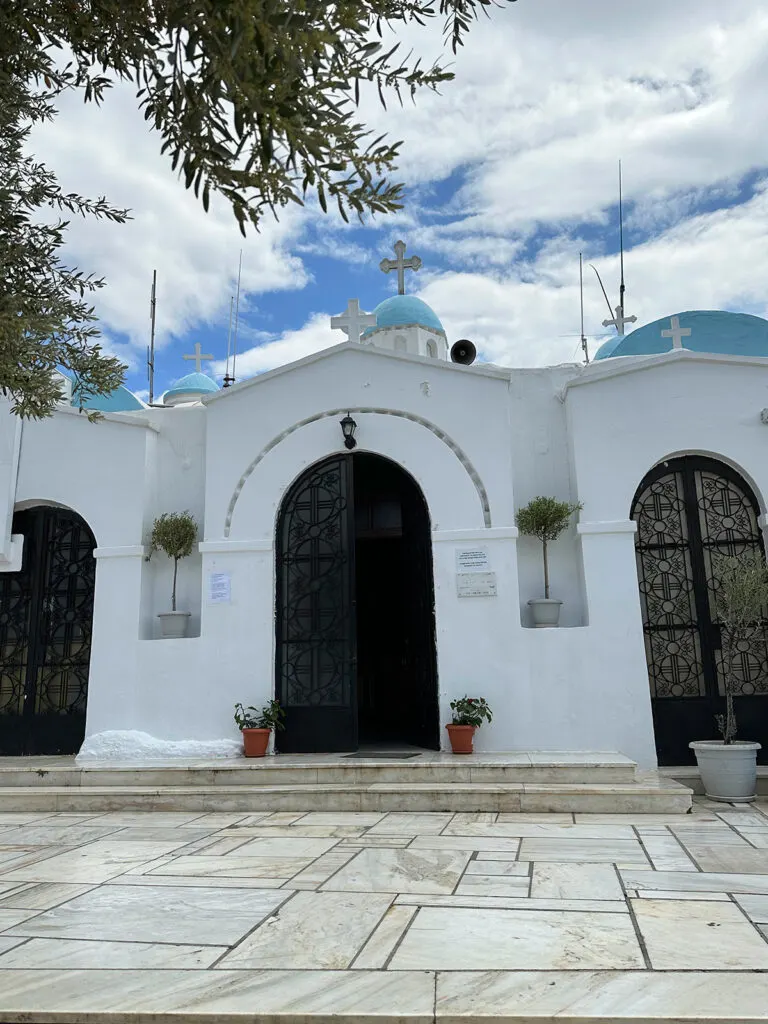 church front with stone steps white building and blue domes while determining how many days in athens