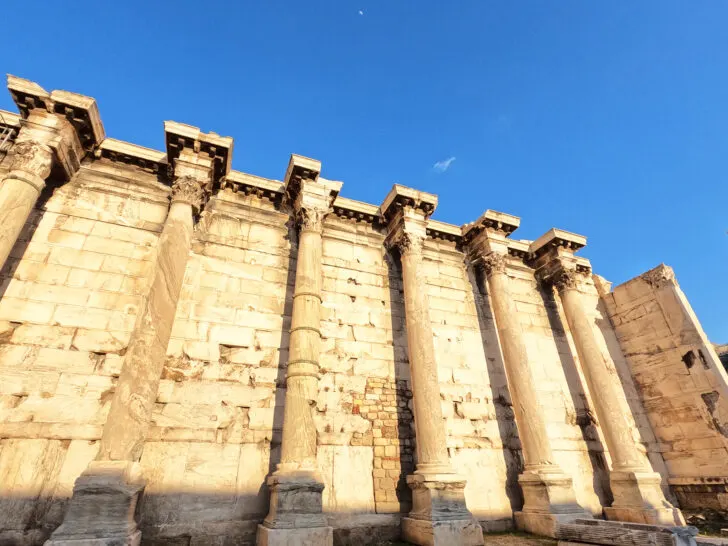 large building with pillars and shadow at bottom during athens 2 day itinerary