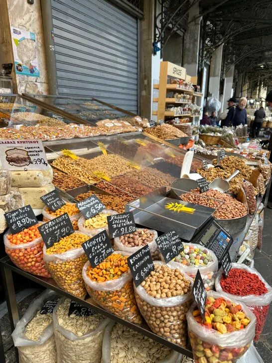 bags and bins of spices nuts and other foods at market in downtown Athens Greece