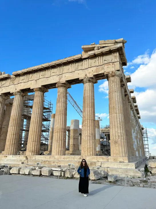 woman standing at ancient statue with columns and ruins 2 days in athens