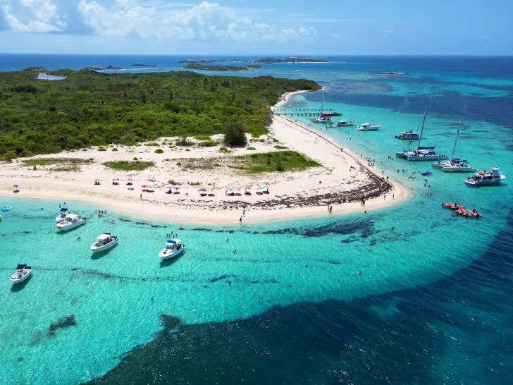 Icacos Island Puerto Rico from a distance with boats and island plus teal water