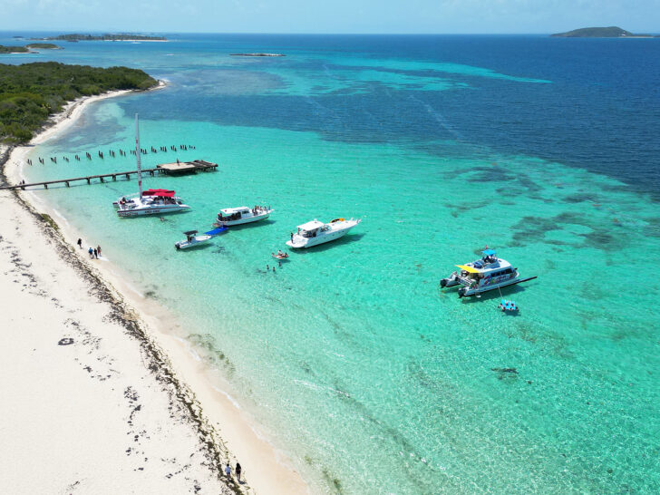 Icacos Island Puerto Rico view of boats on teal water with white sandy shore