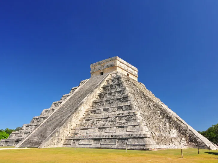 large pyramid in Mexico on sunny day with steps leading up it