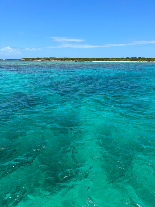 Icacos Puerto Rico teal water with blue sky and strip of land in distance