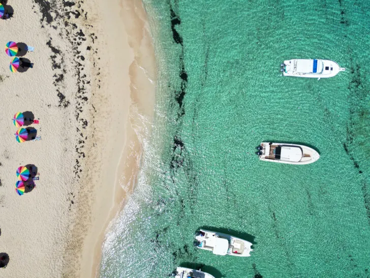Icacos Puerto Rico aerial view of boats teal water and umbrellas