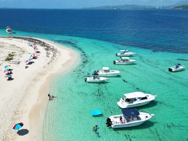 Cayo Icacos view of boats in water with beach and teal and blue water