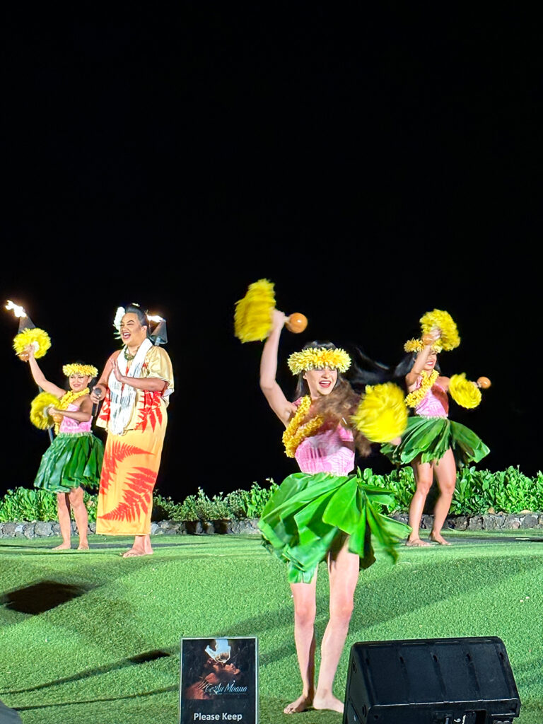 hula women dancing on stage at night