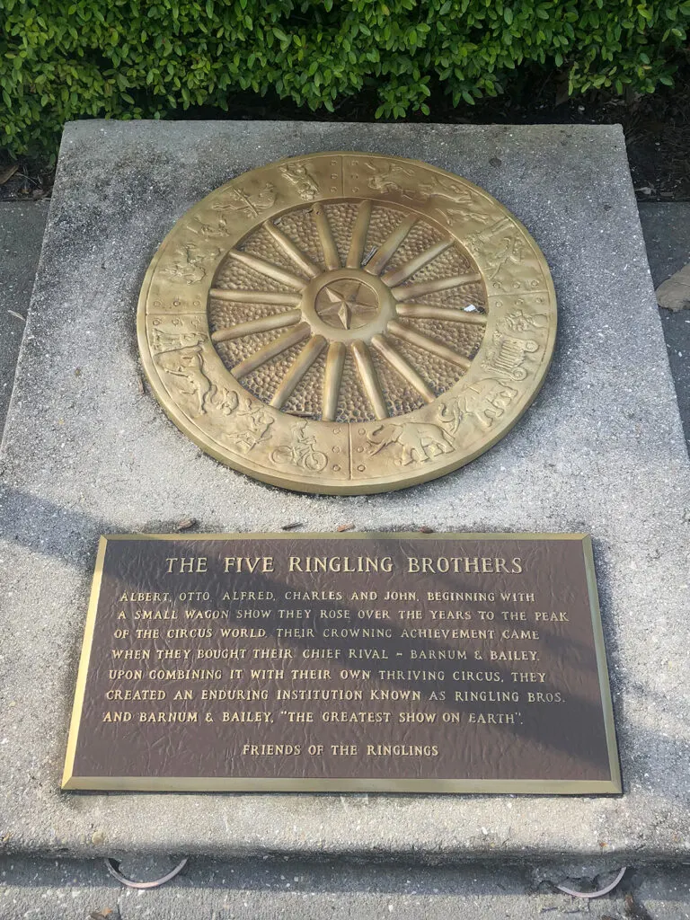 five ringling brothers plaque with wheelspokes on concrete