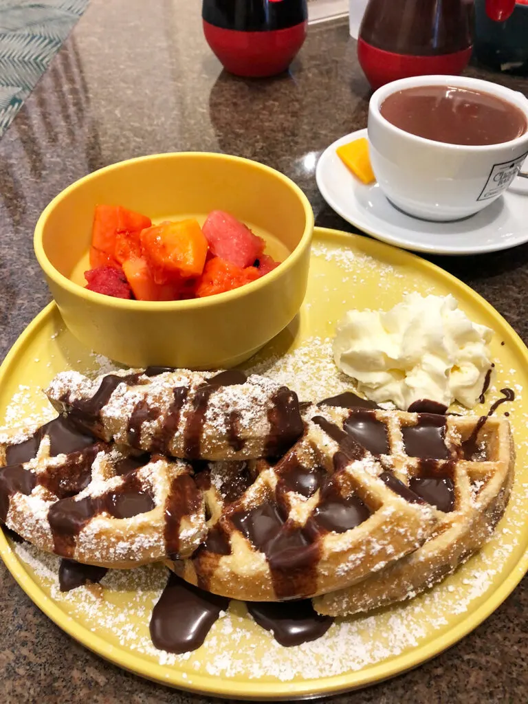 old San Juan food tour view of waffles and fruit with chocolate syrup