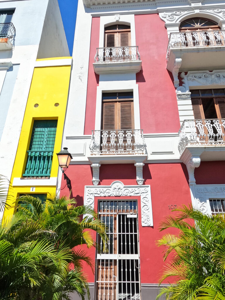 impressive architecture things to see in old San Juan red yellow buildings with palm trees