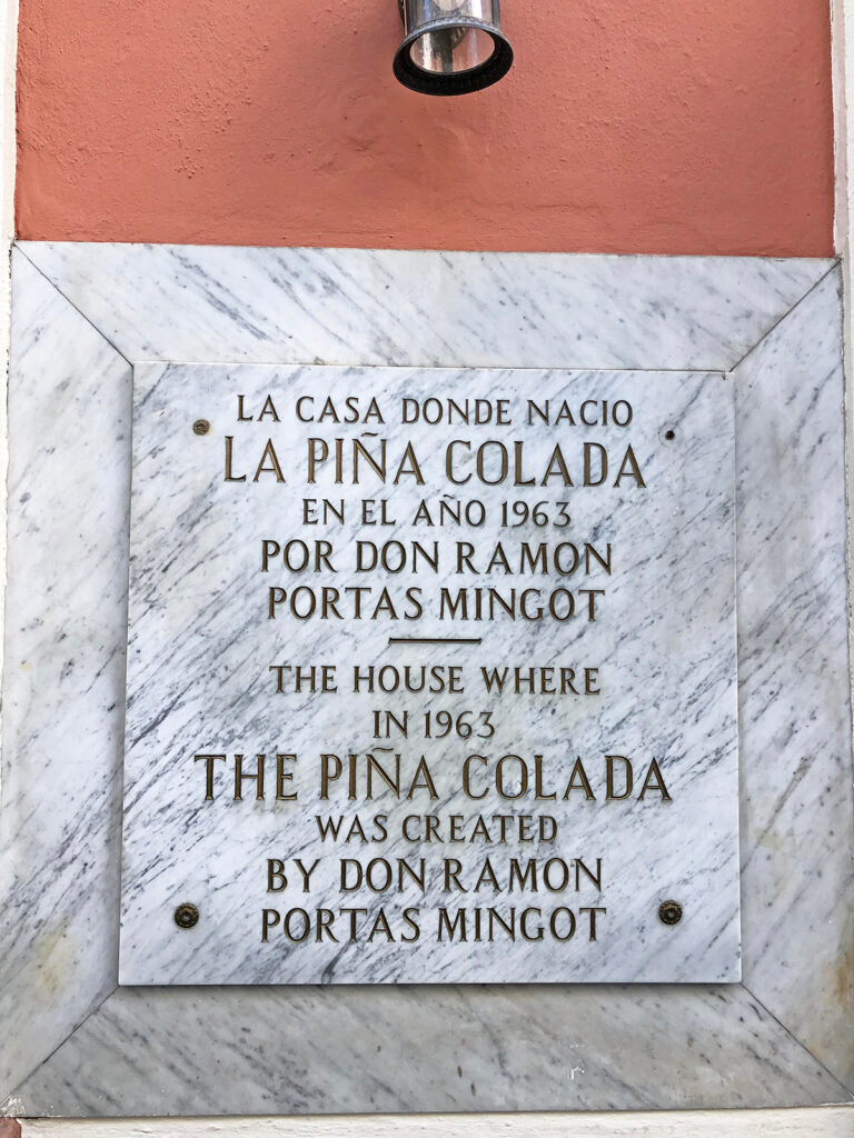 la pina colada sign on building describing where it was created