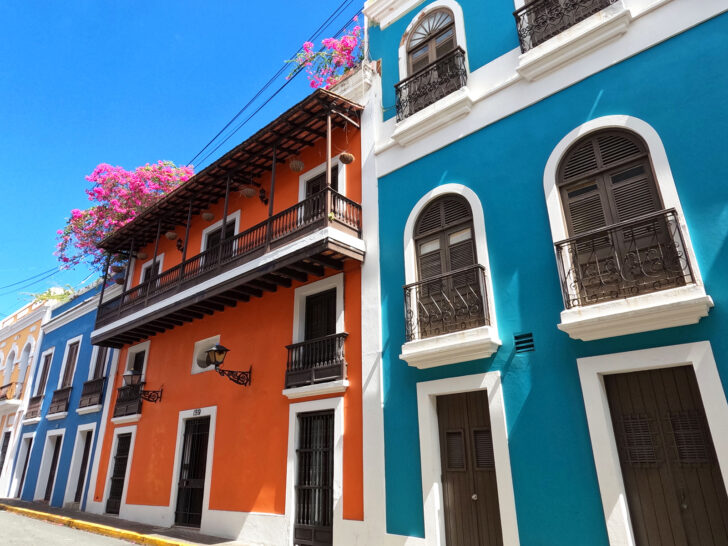 Old San Juan Puerto Rico view of beautiful old buildings with multi colors and balconies with pink flowers