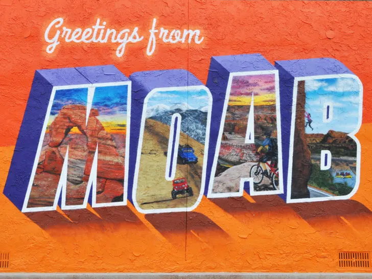mural that says greetings from moab with paintings within each MOAB letter
