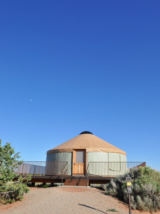 round yurt in desert with blue sky