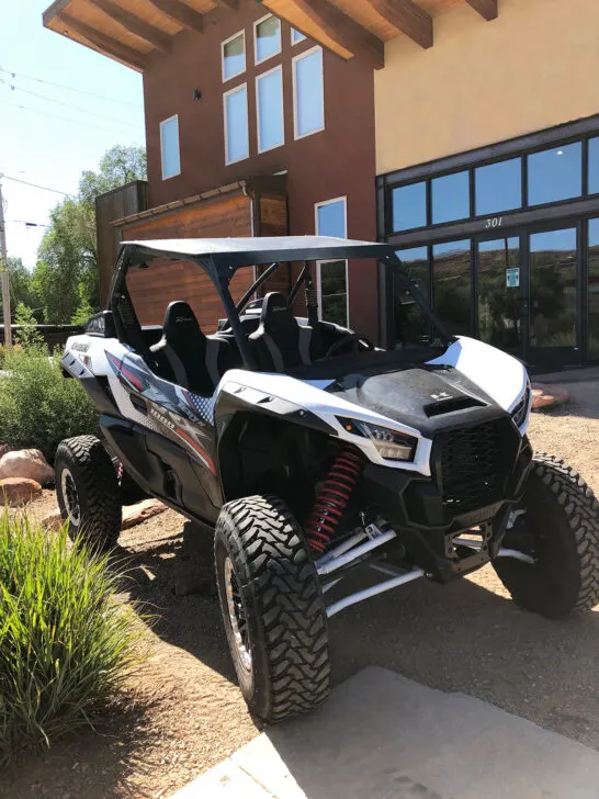 UTV sitting in front of building top things to do in Moab