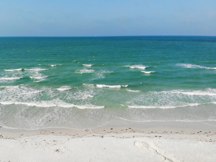 things to do in Siesta Key Florida with view of teal water and white sand photo from a drone