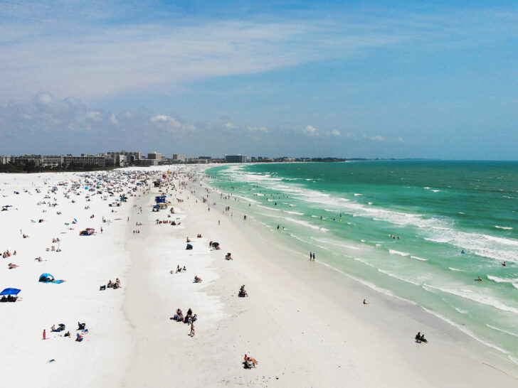 things to do in Siesta Key with aerial view of white sand beach and teal water along coast