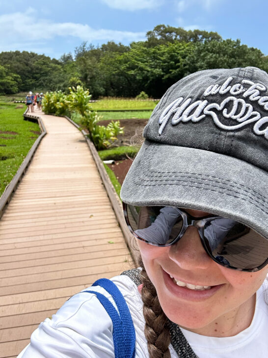 woman's face with gray aloha Hawaii hat