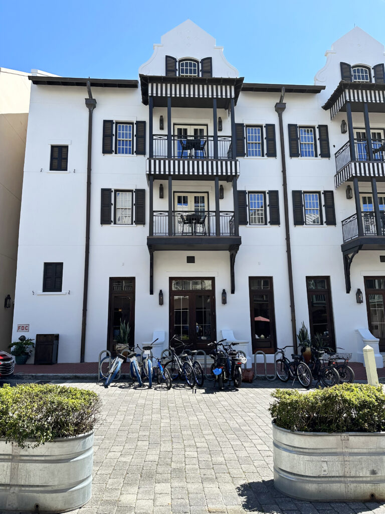 black and white building with bikes in front of it