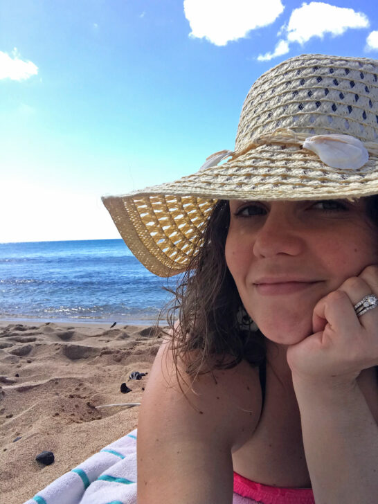 woman on beach with beach hat