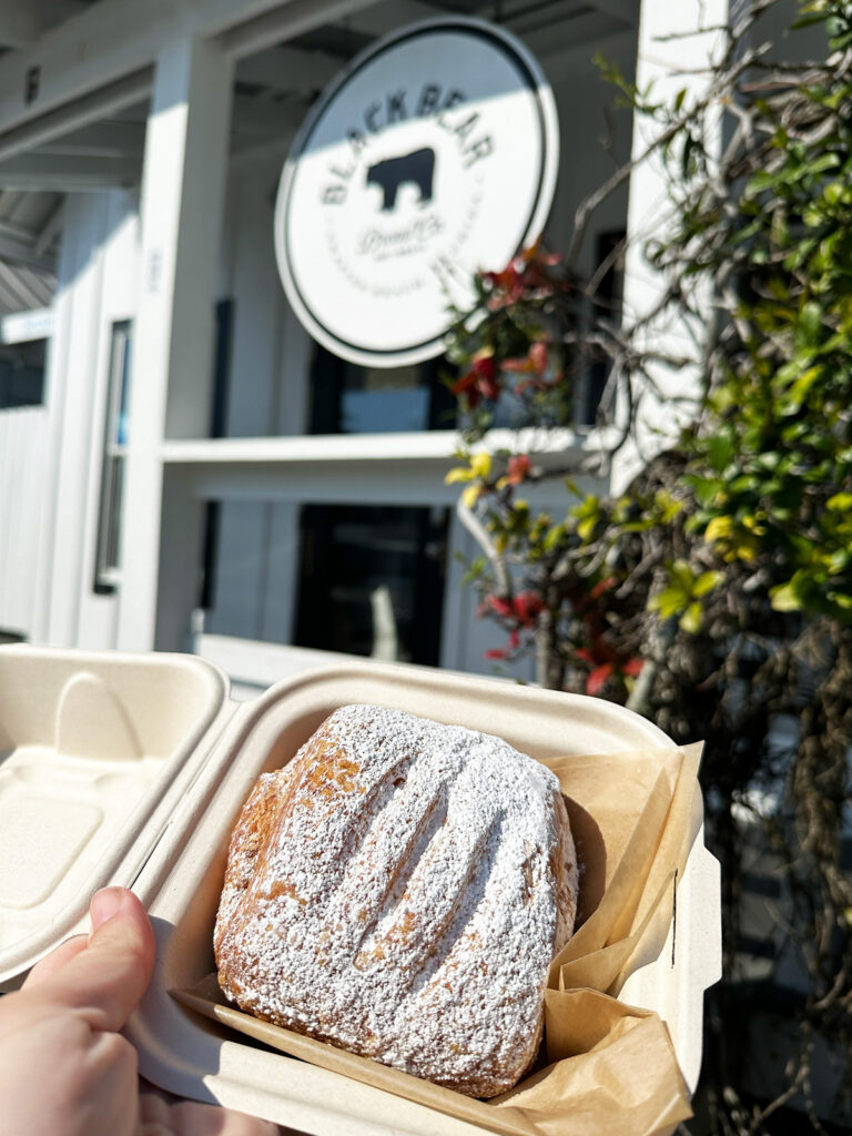 best restaurants on 30a view of pastry in box with sign in distance that reads black bear