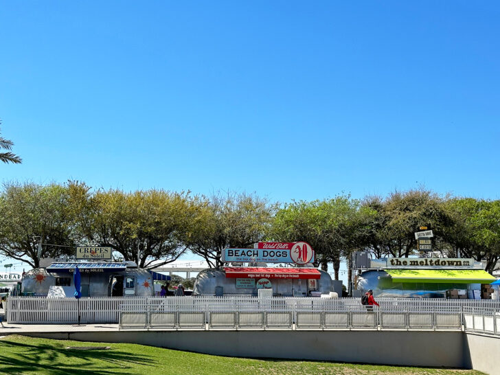 airstream food trucks with trees and blue sky