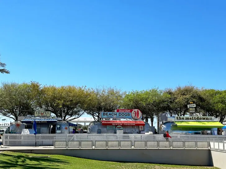 airstream food trucks with trees and blue sky