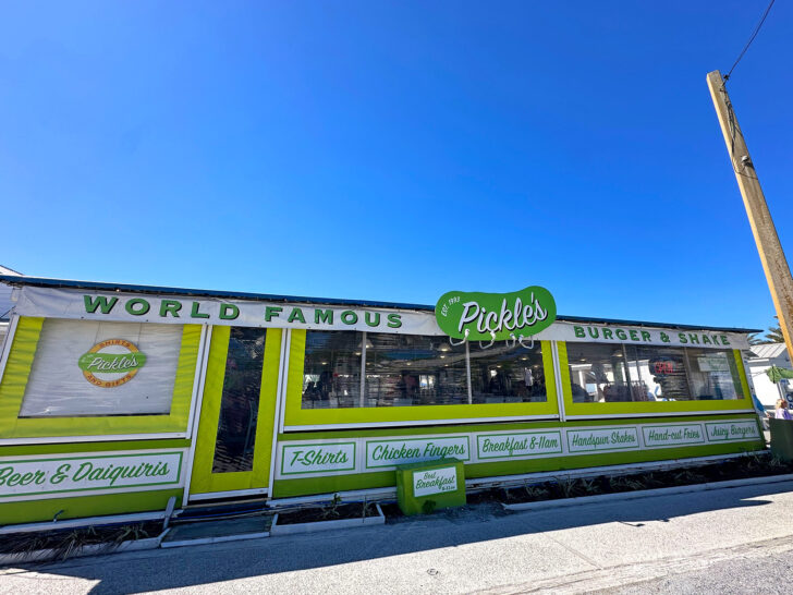 restaurant front with signs that read world famous pickle's burger & shake