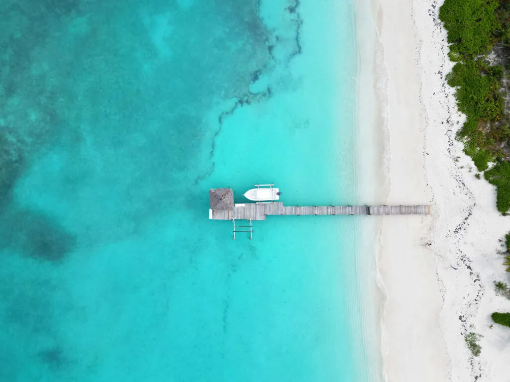 learn how to fly a drone with aerial view of a dock in the Bahamas