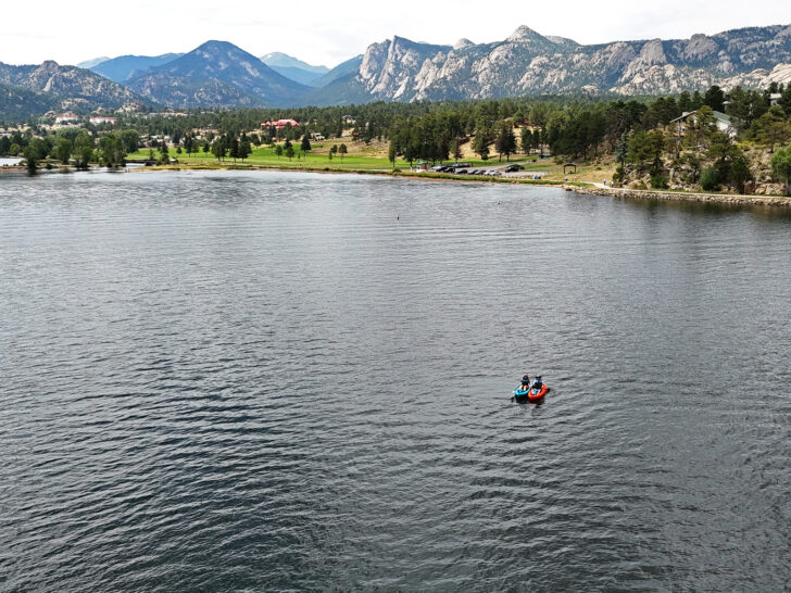 two kayaks on lake in Estes view of best mountain towns in Colorado