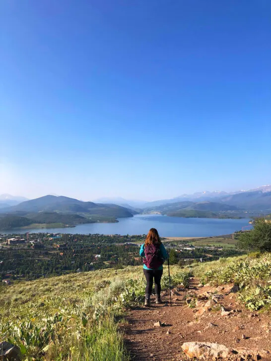 woman hiking on trail in dirt at Silverthorne Colorado mountain towns