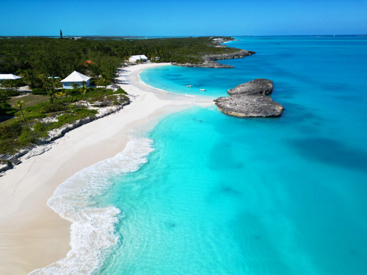 best exuma beaches from above with view of teal water with white waves and double coves along coastline