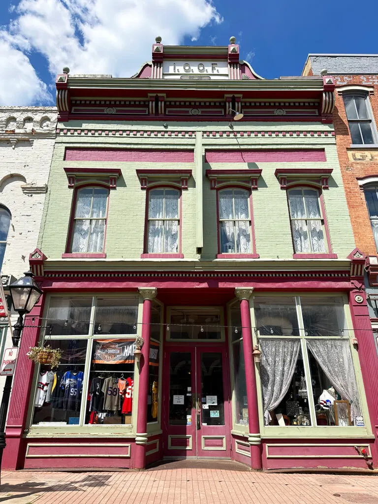 green and purple building on sunny day