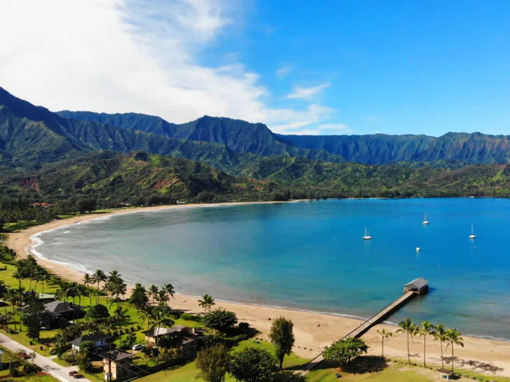 amazing drone photos of Hanalei bay with mountain ridges and beach