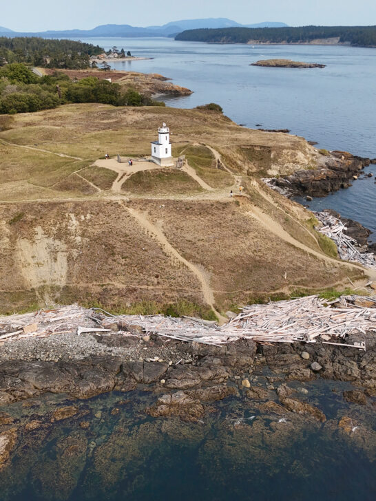 view of a lighthouse and rocky coastline