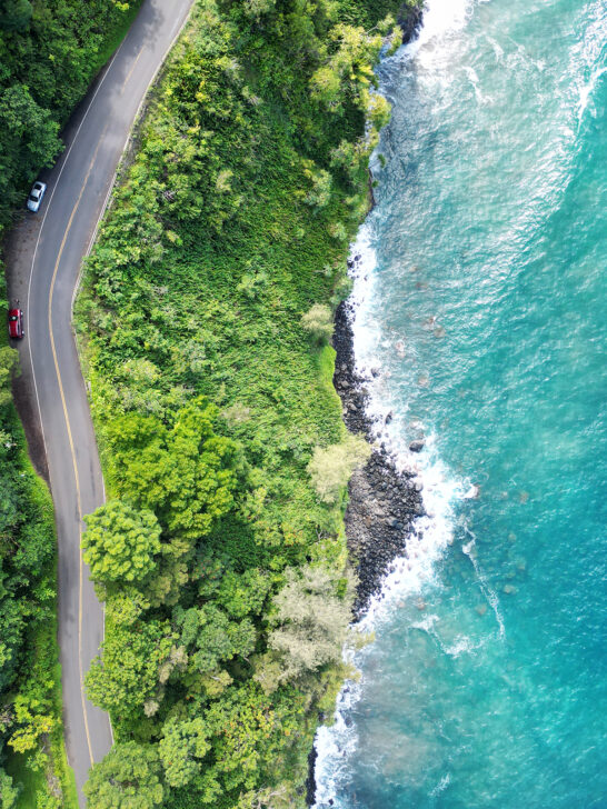 drone view of the coast along the road to Hana maui with road and coast and blue water