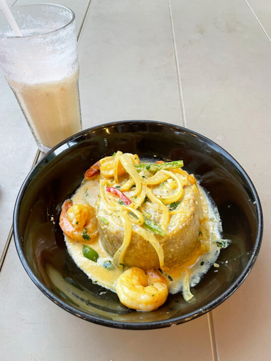 shrimp mofongo in black bowl and drink cup at old San Juan best restaurants