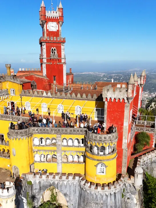 aerial view of castle with orange and yellow exterior