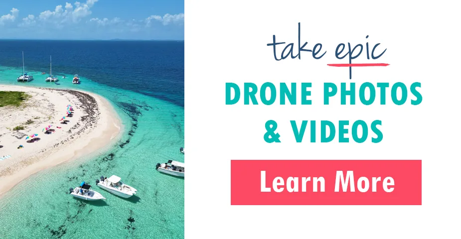 aerial view of island and boats with text that reads take epic drone photos and videos learn more