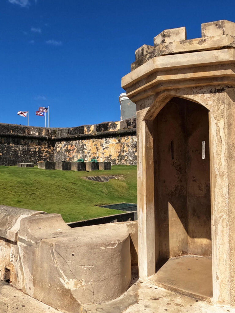 exploring del Morro San Juan Puerto Rico with view of fort exterior and flags