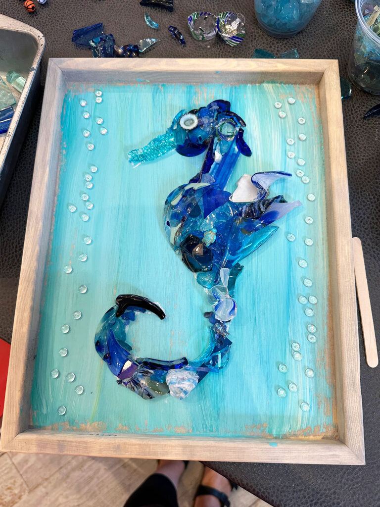 wooden frame with blue pieces of glass shaped like a seahorse best activities 30a florida with kids