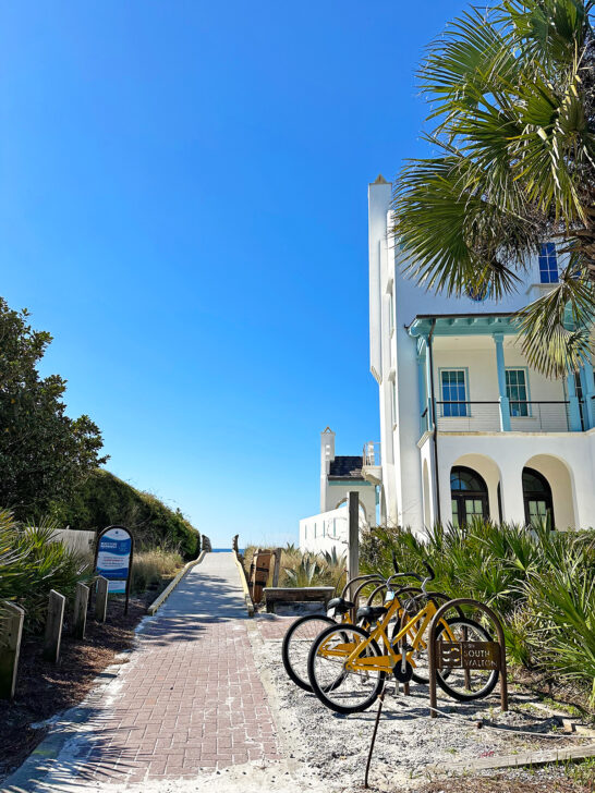 florida spring break ideas view of bikes waiting near beach path with building beside it