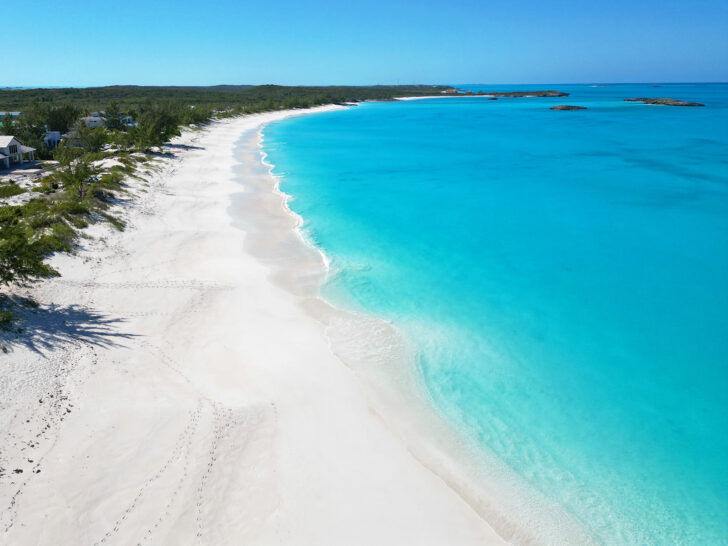 visit Exuma bahamas view of beautiful empty beach white sand teal water natural coastline