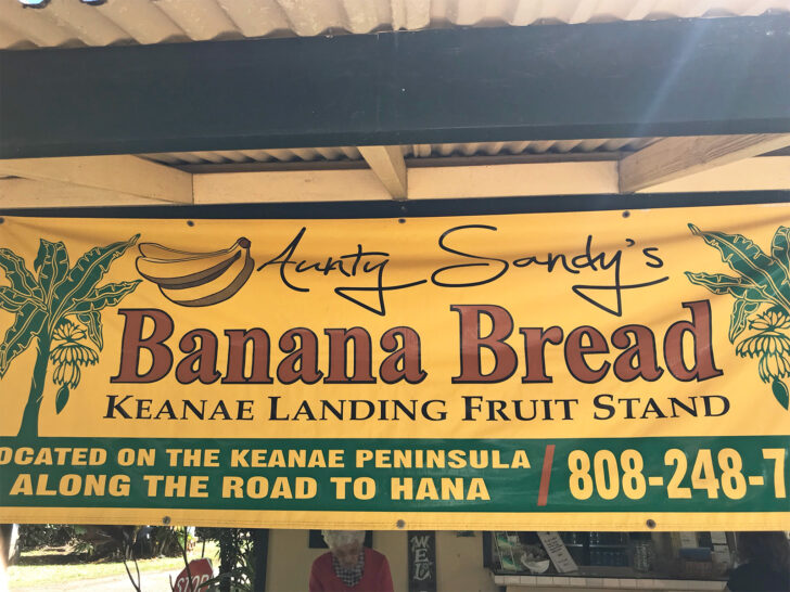 sign that says aunty sandy's banana bread with location and phone number